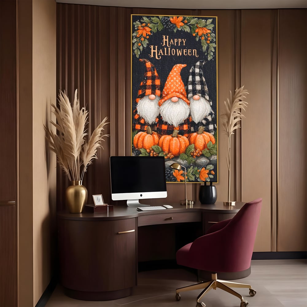 Tablou canvas cu ilustratie cu trei gnomi de halloween, in rama de aluminiu auriu, pe perete intr-un birou